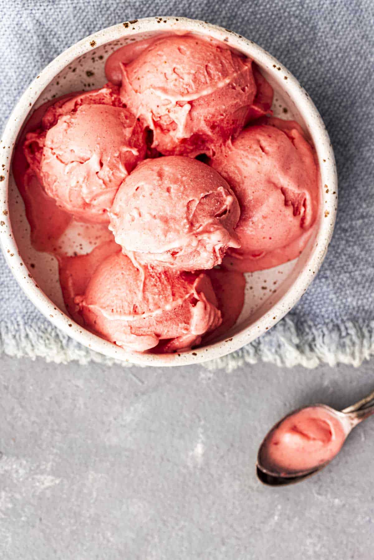 Ninja Creami Strawberry Ice cream scoops in a white bowl.