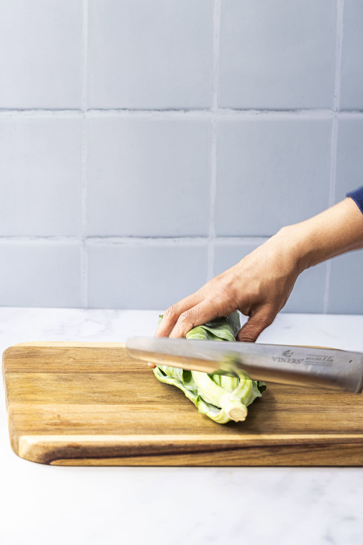 trim the tough and wilted leaves from spring cabbage greens.