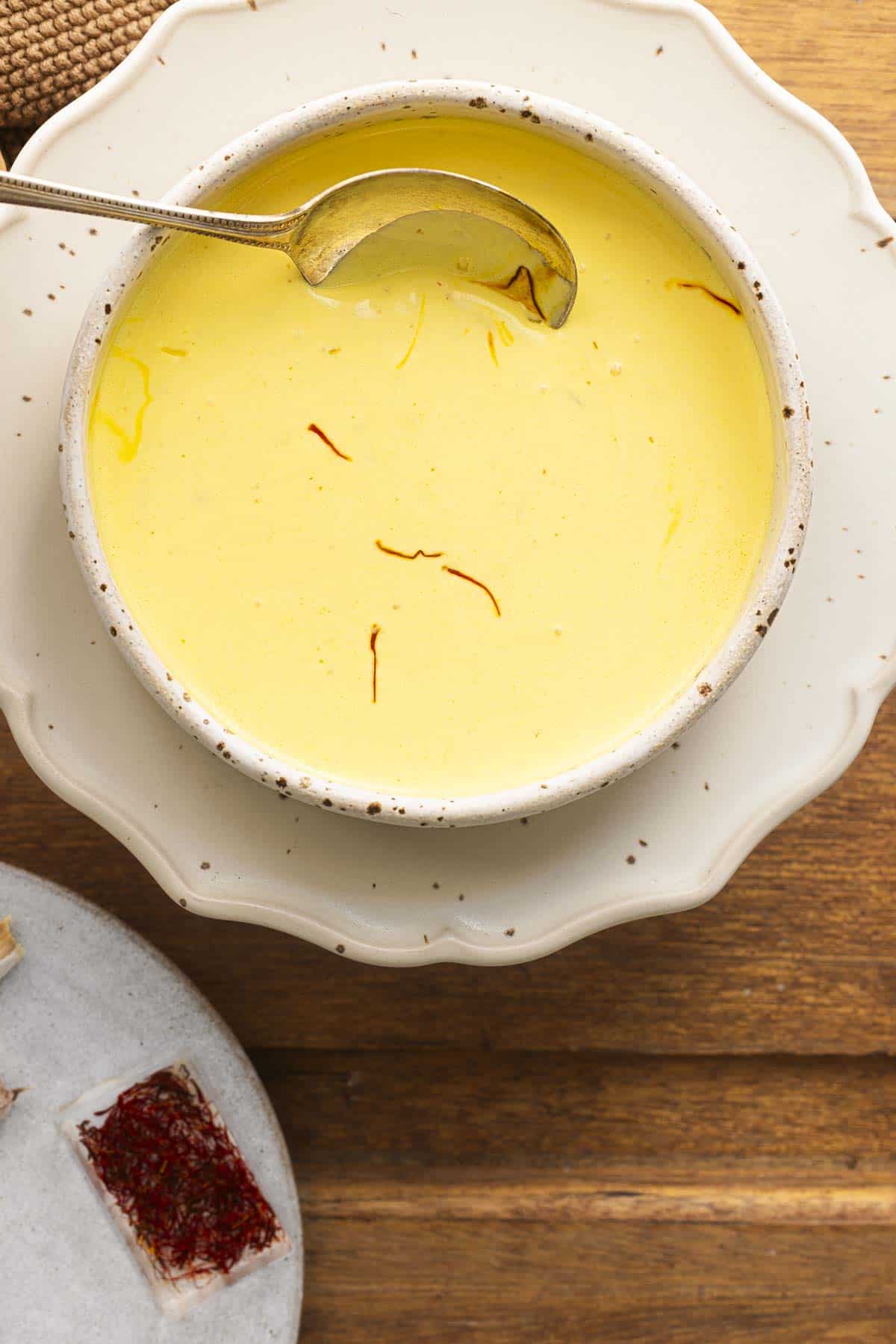 saffron cream sauce in a white bowl.