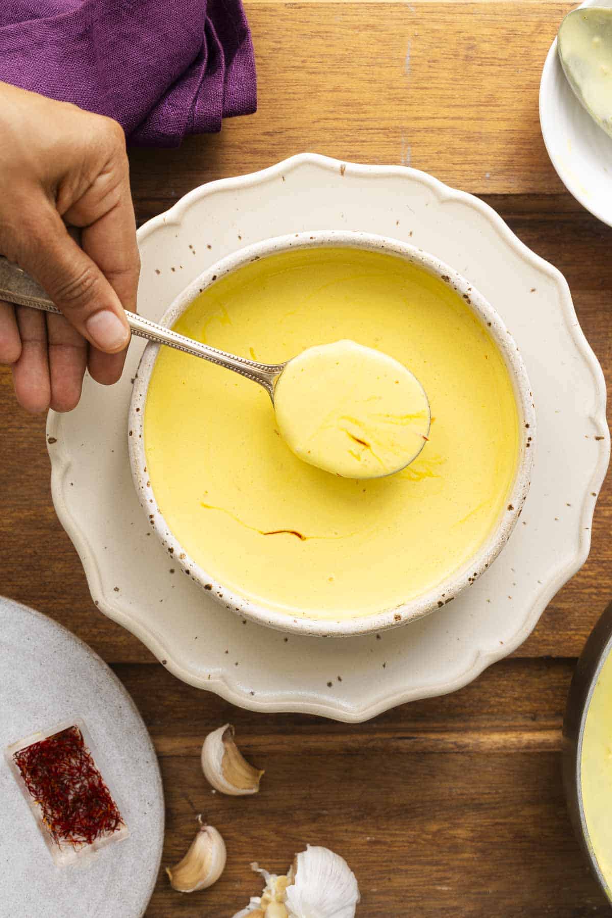 saffron cream pasta sauce in a white bowl.