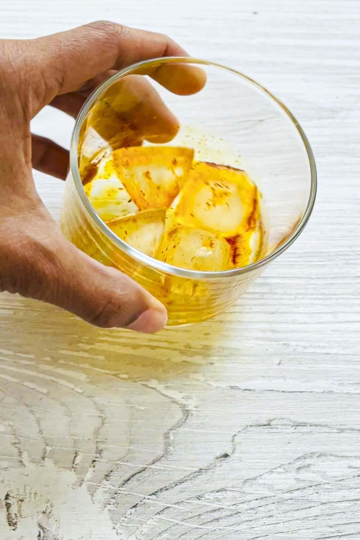 saffron and ice cubes in a small bowl.