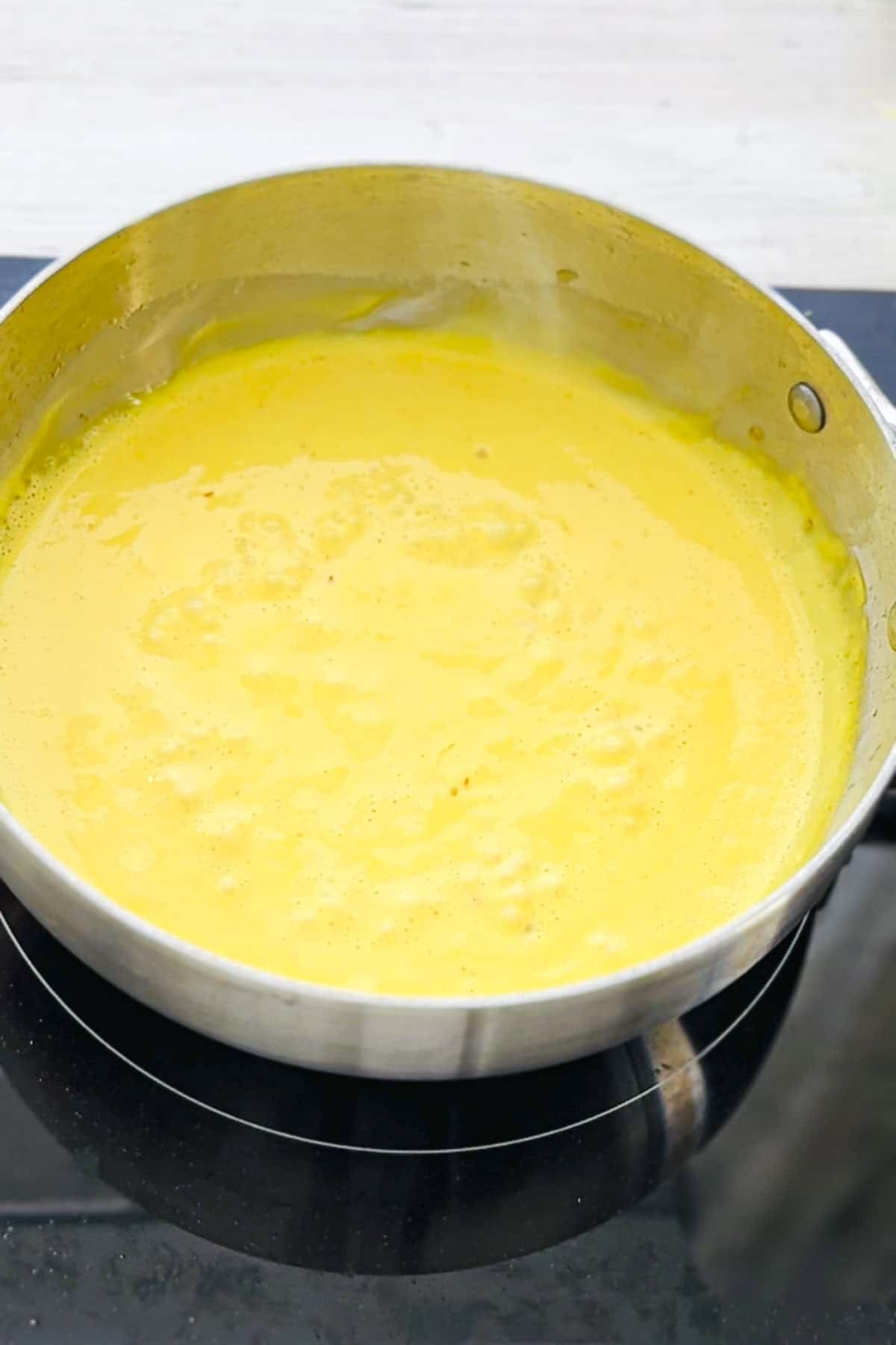 saffron cream sauce in a sauce pan.