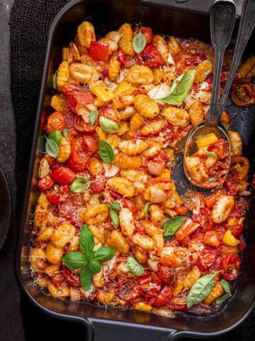 tomato and gnocchi tray bake served with garlic bread.
