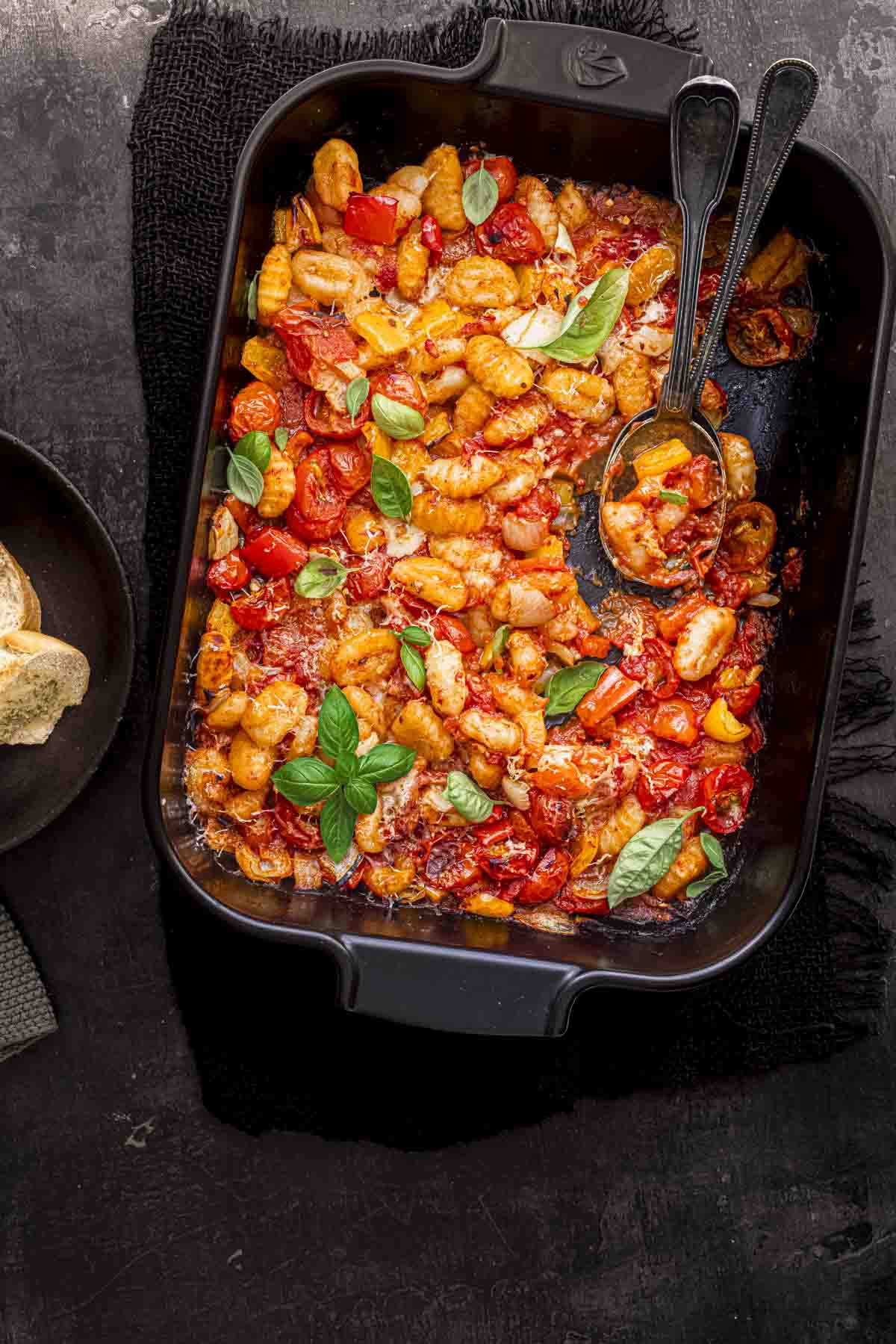 tomato and gnocchi bake in a roasting dish.