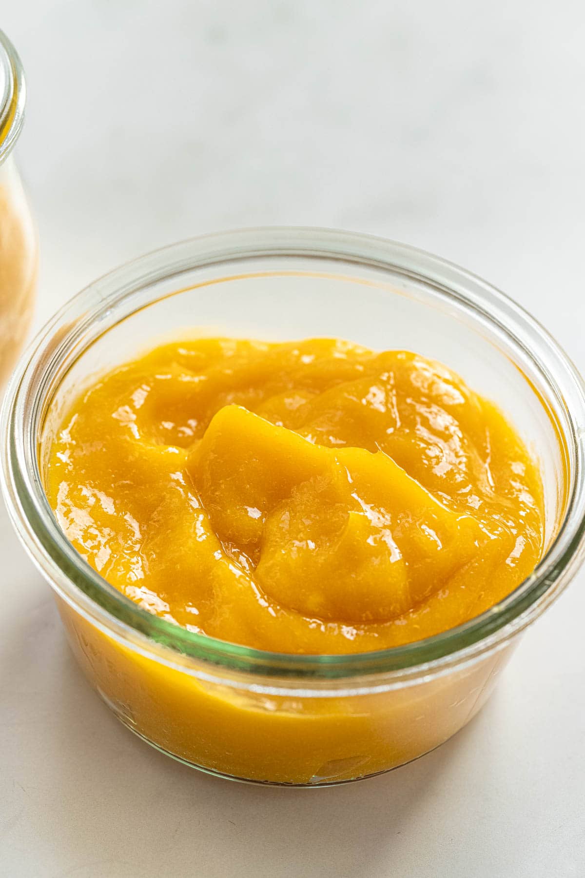 creamy mango pulp in a mason jar.