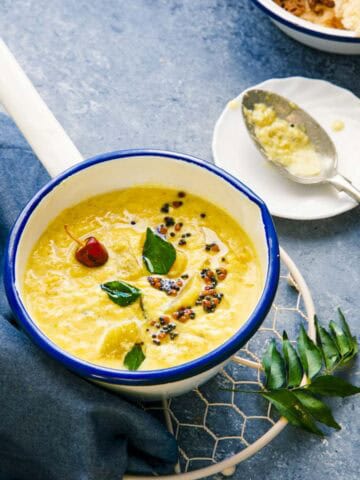 Kerala Mango Curry in a sauce pan with tempering.