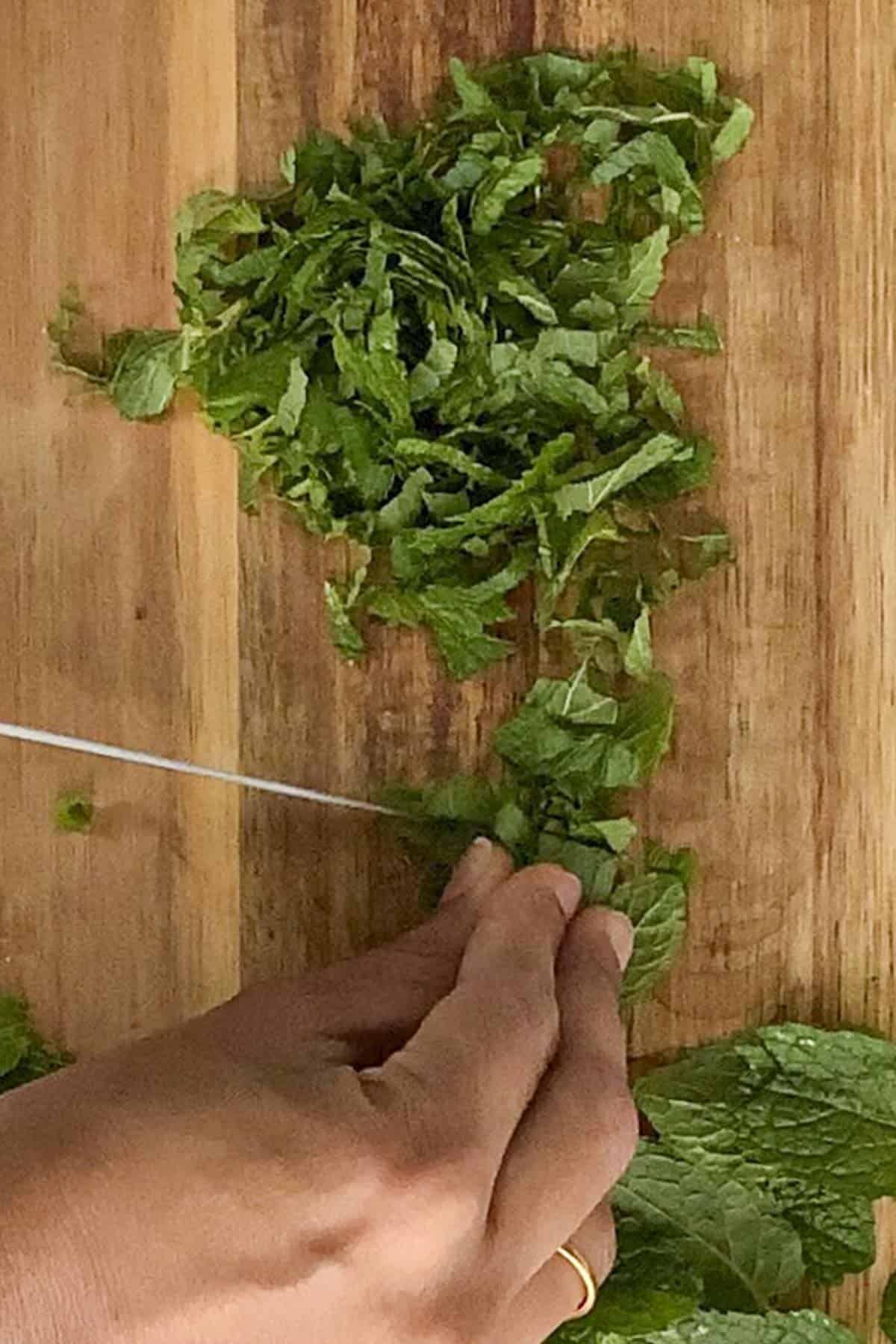 chop the mint leaves finely for making British Mint Sauce.
