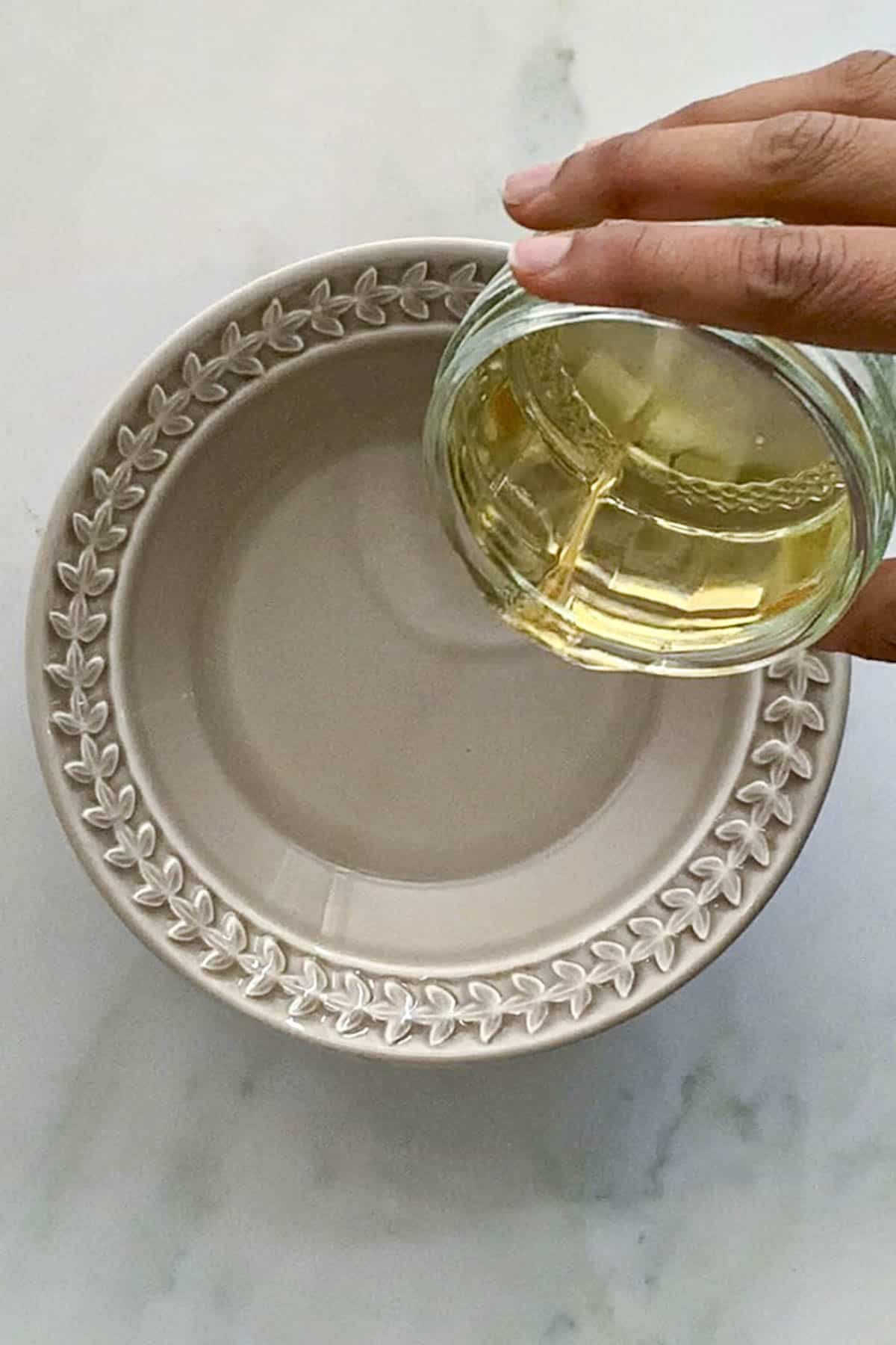 Preparing a vinegar based mixture for the mint sauce.