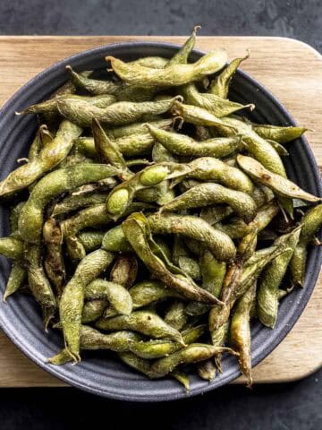 air fried edamame beans in a grey bowl.