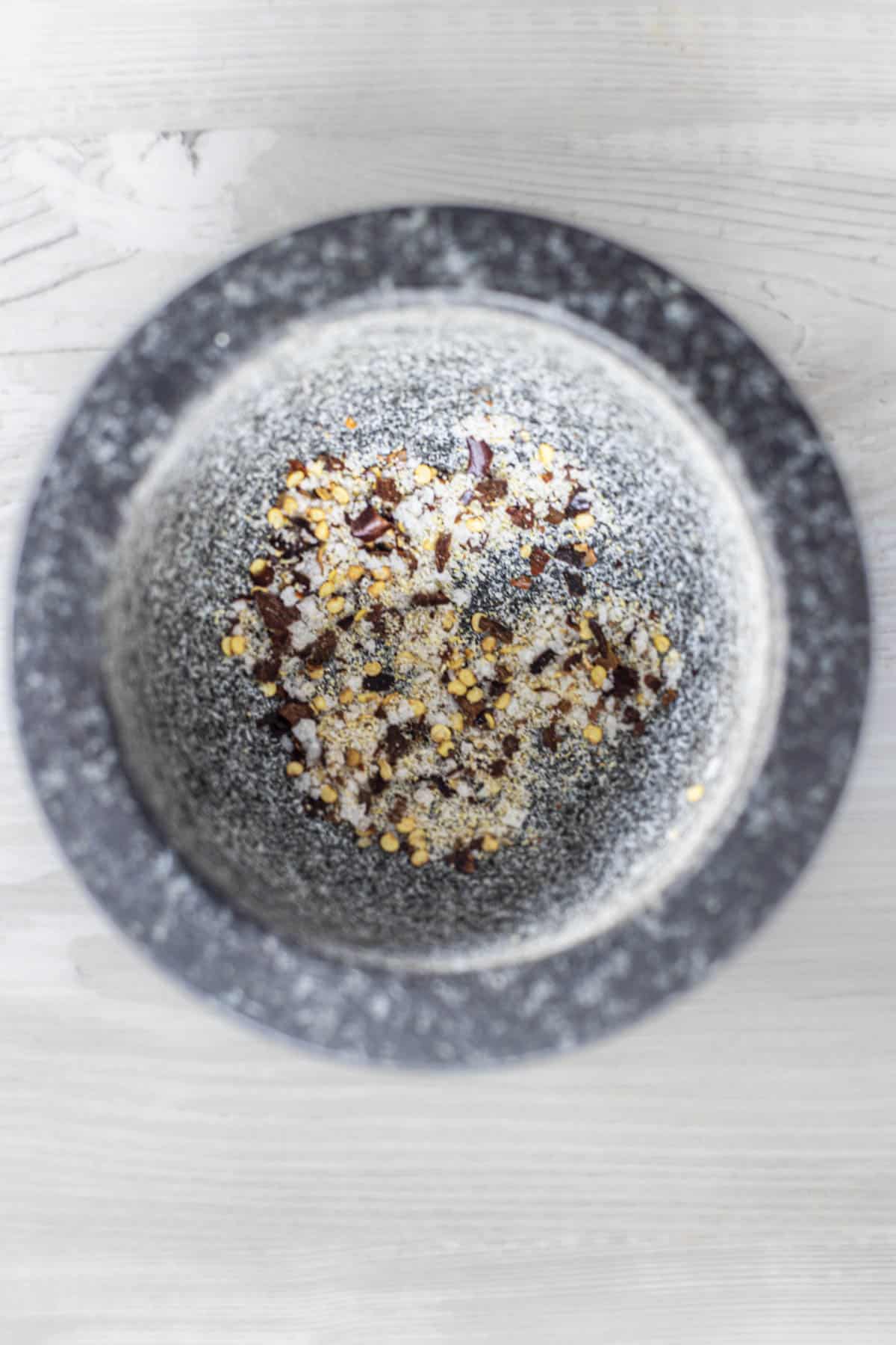 make chilli garlic salt seasoning in pestle mortar.