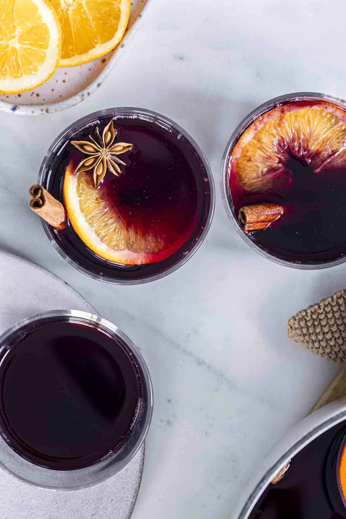 three glasses of spiced red mulled wine.