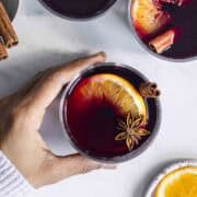 three glasses of spiced red mulled wine.