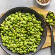 a bowl of salt and chilli edamame beans.