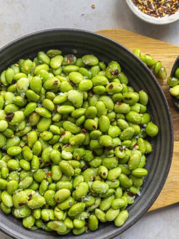 a bowl of salt and chilli edamame beans.