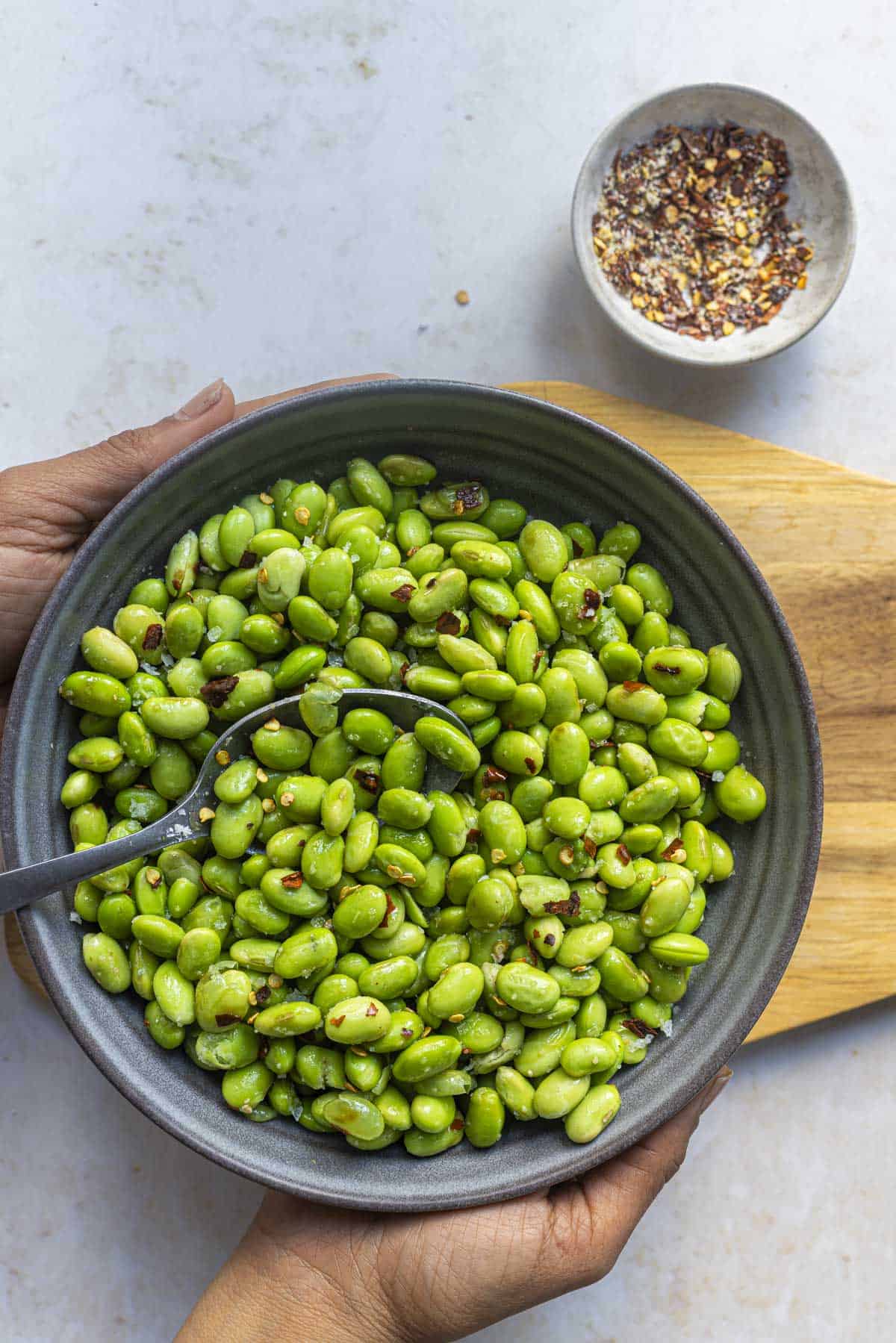 a bowl of salt and chilli edamame beans.
