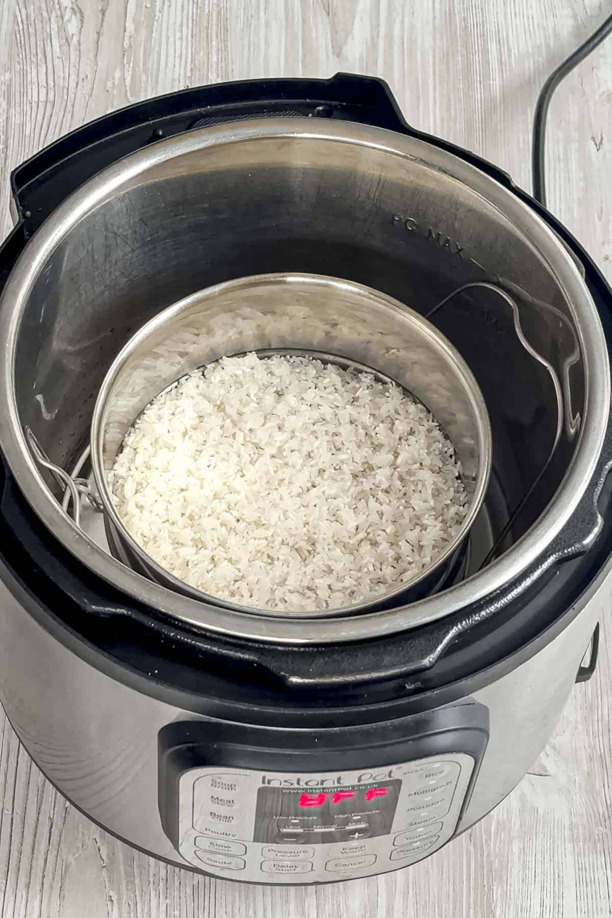 washed sona masoori rice in a pot inside the inner pot of instant pot.
