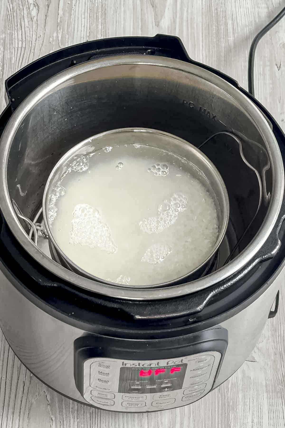sona masoori white rice and water in a pot inside instant pot.