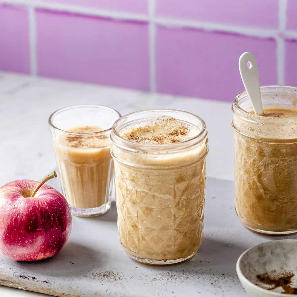 three cups of fresh cinnamon apple smoothie.