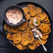 air fried sweet potato slices served with sauce.