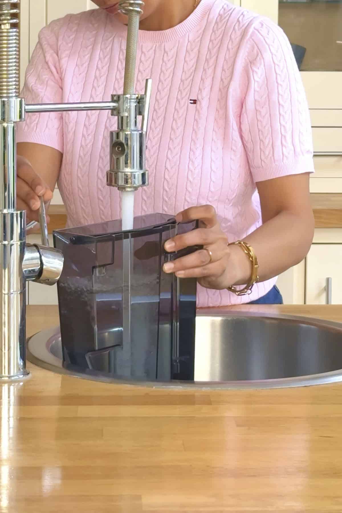 filling water tank for the coffee machine.