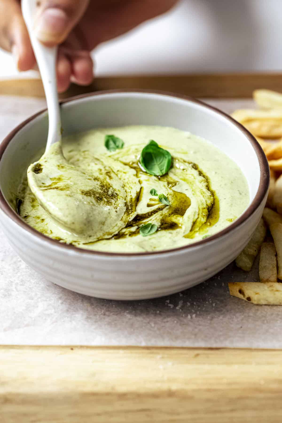 pesto mayonnaise served with fries.