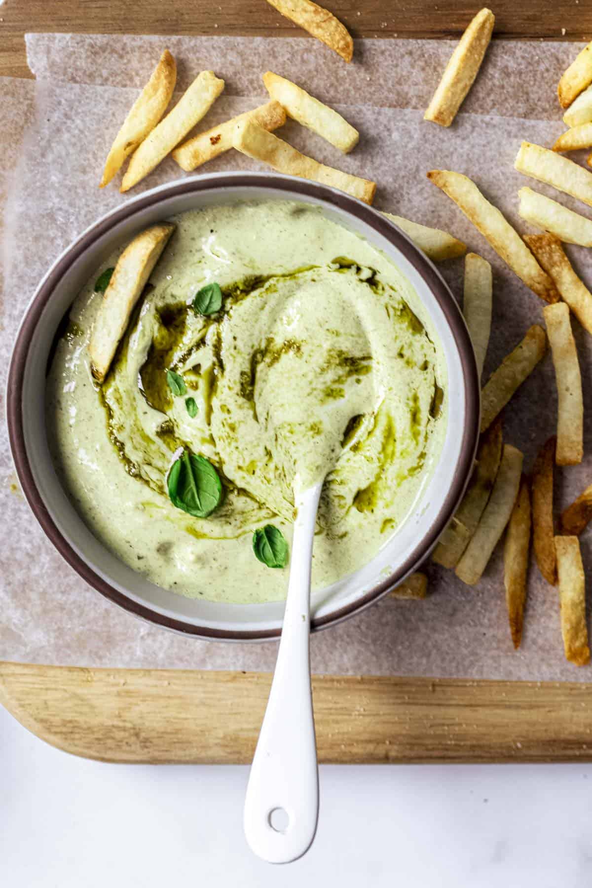 pesto mayo served with french fries.