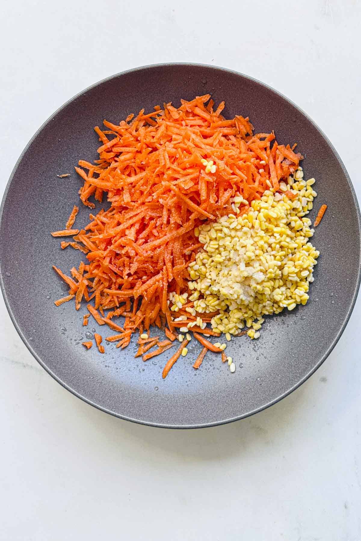 carrots and moong dal in a wide bowl.