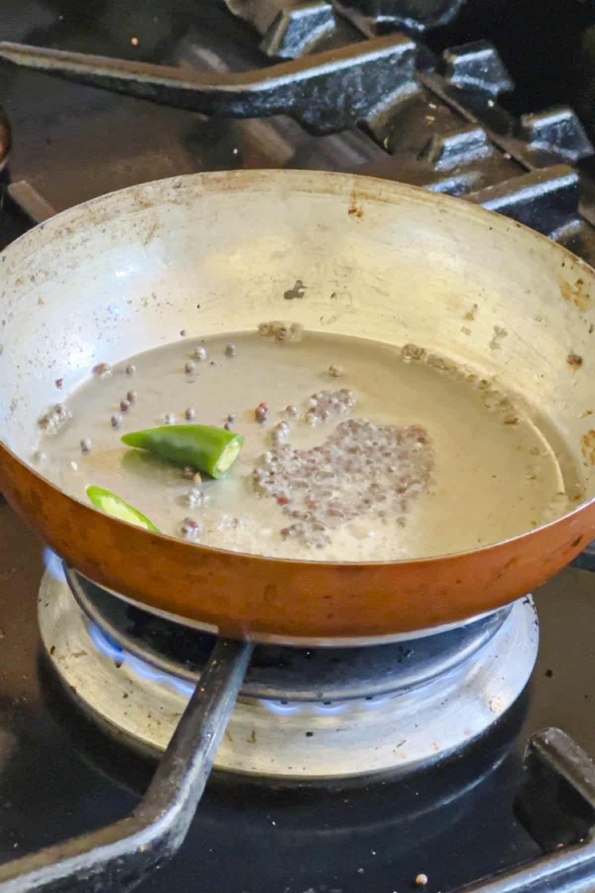 South Indian tempering in a small frying pan for kosambari.