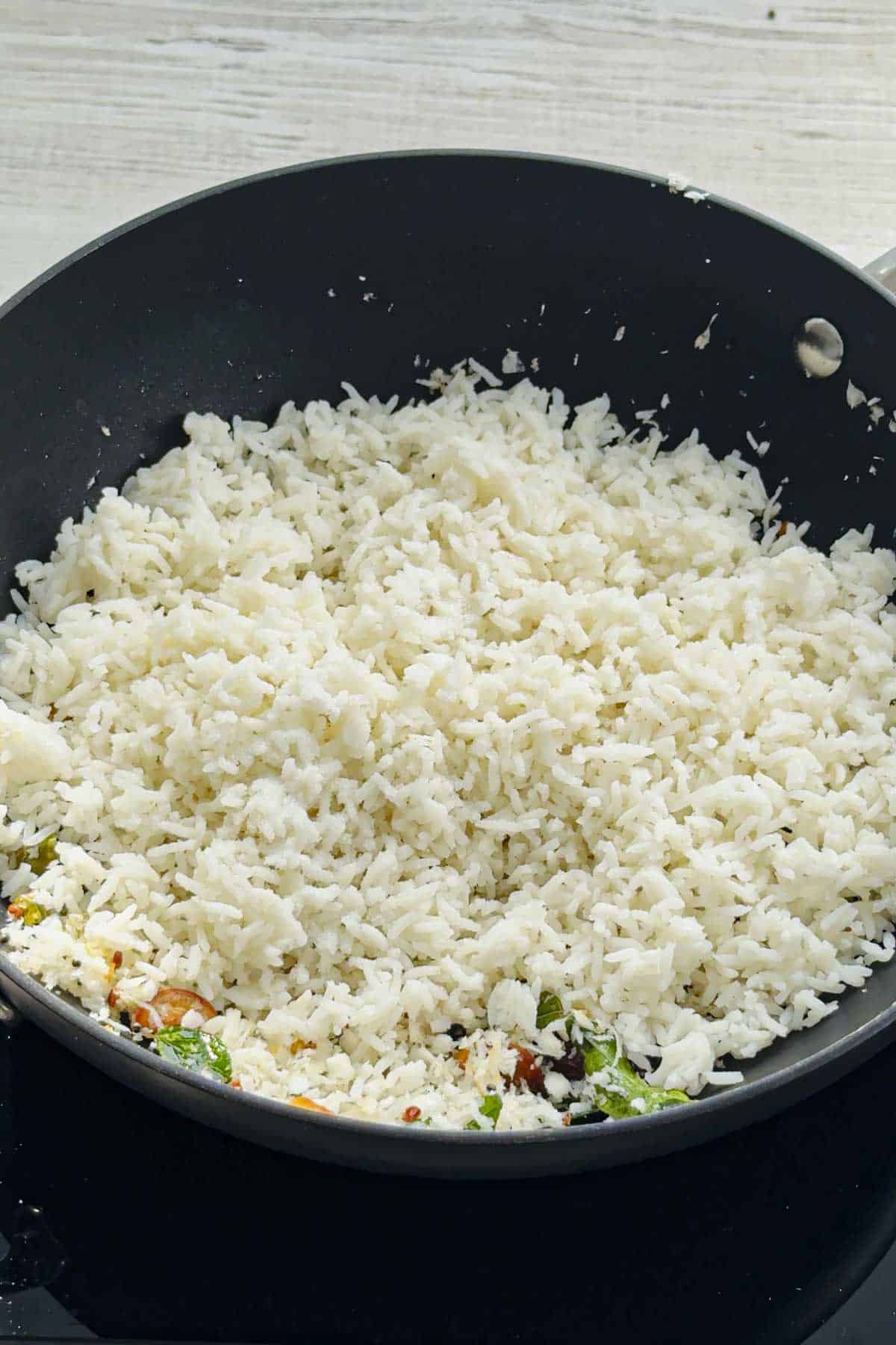 fresh cooked rice over the south indian tempering.