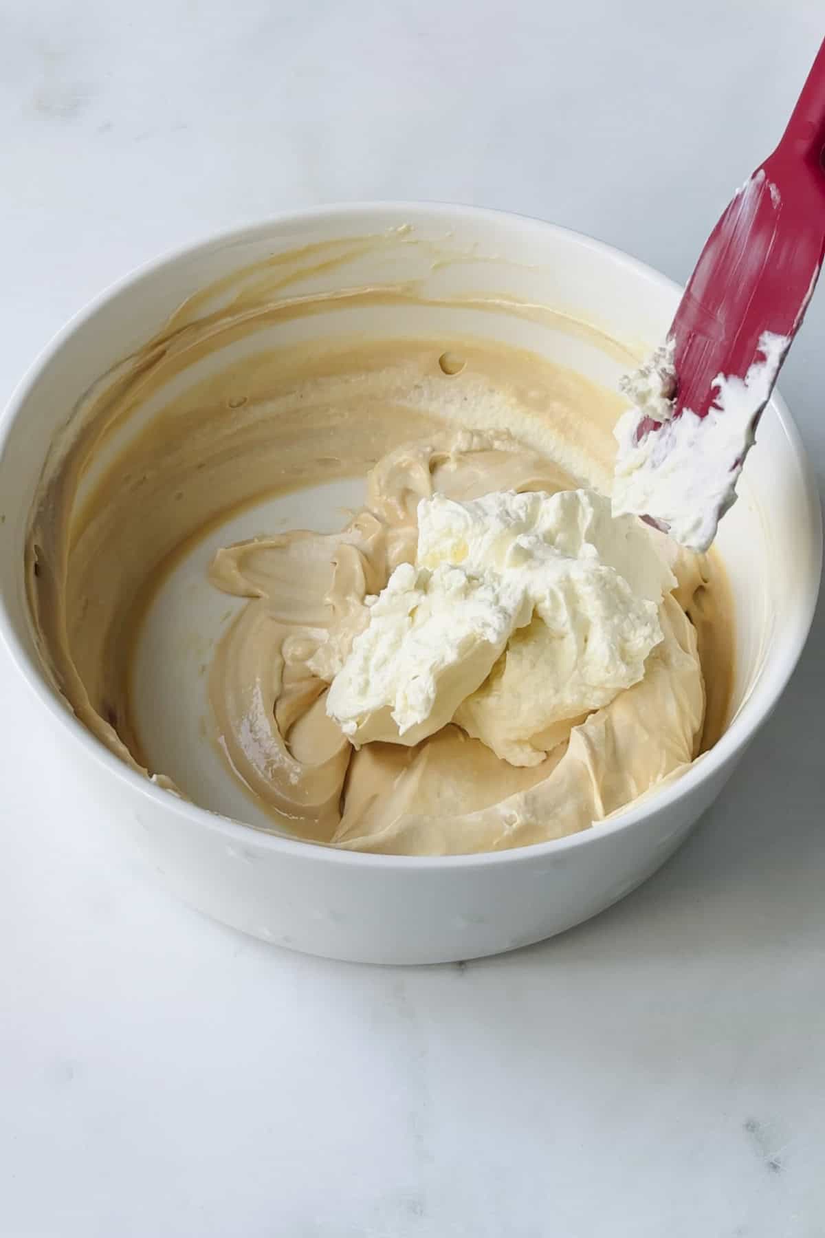 fold whipped cream into the caramel mixture.