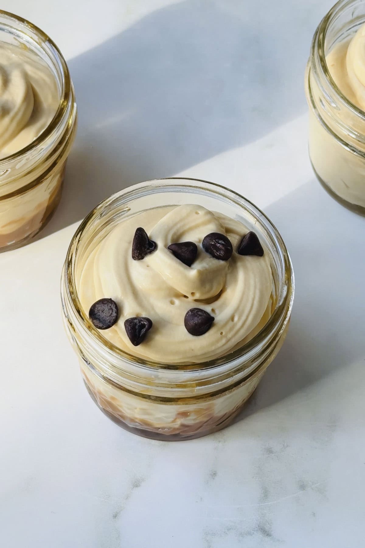 three jars of caramel mousse.