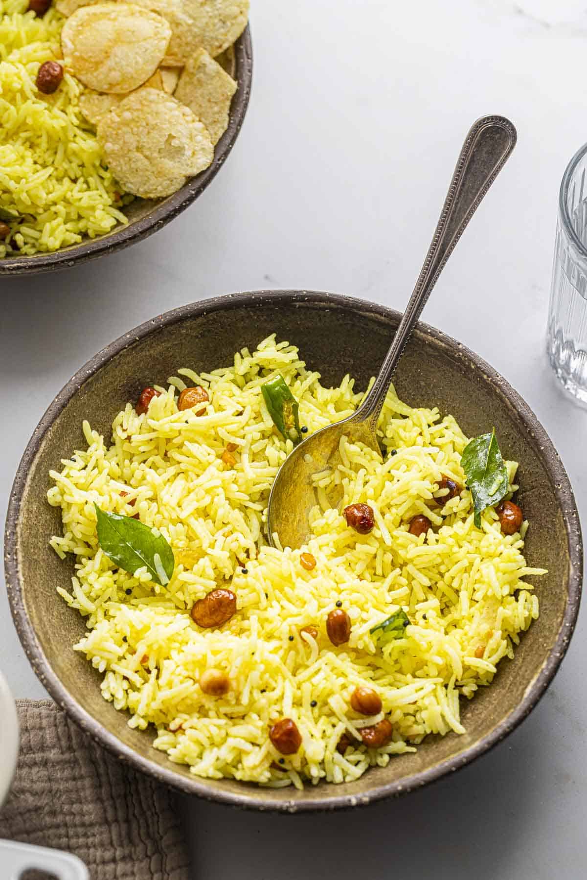 two bowls of Indian lemon rice.