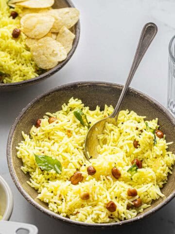 South Indian lemon rice served in brown bowls.