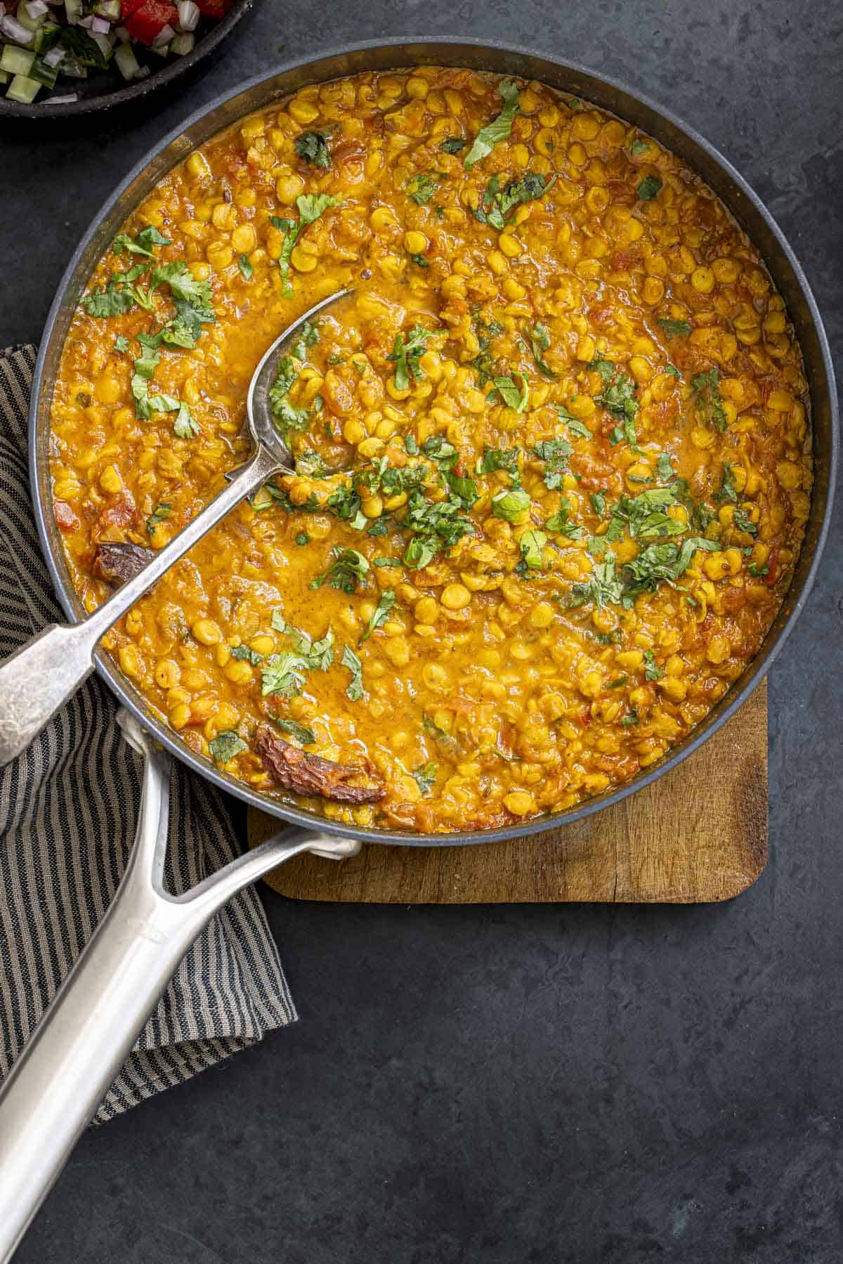 chana dal served in a ceramic pan.